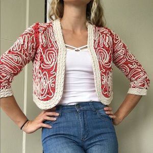 Crocheted red and white cropped cardigan