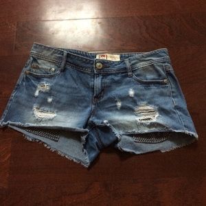 Distressed jean shorts w/ showing pockets