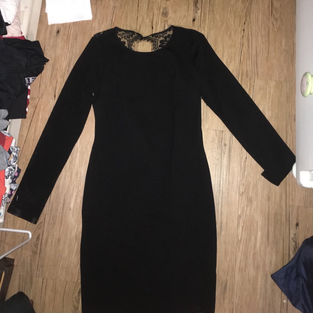 Selling a long sleeve black backless dress