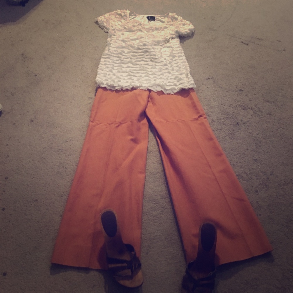 Gucci trousers and cream ruffle shirt