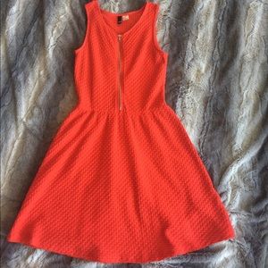 Women's orange zip-front dress.