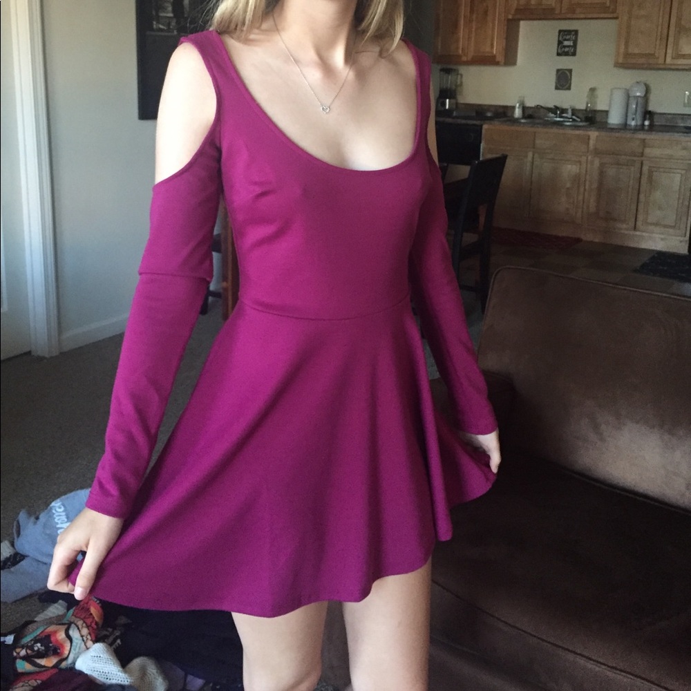 Women's pink mini dress with cutout shoulders.