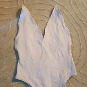 White unitard with low back