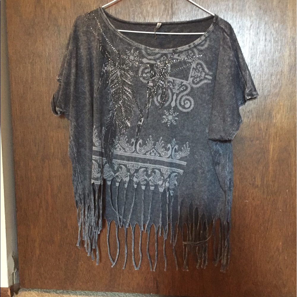 Shirt with strings hanging at the bottom