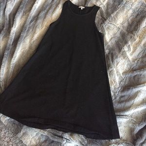 Women's black shift dress.