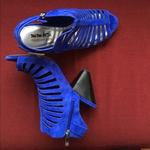 Coach and Four open-toe heel shoes.