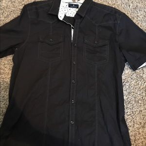 Black button up shirt.