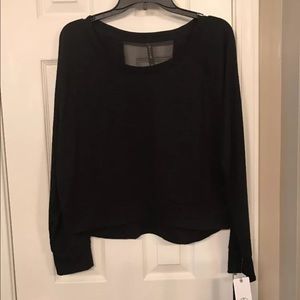 Gaiam yoga top black size large. Mesh back panel