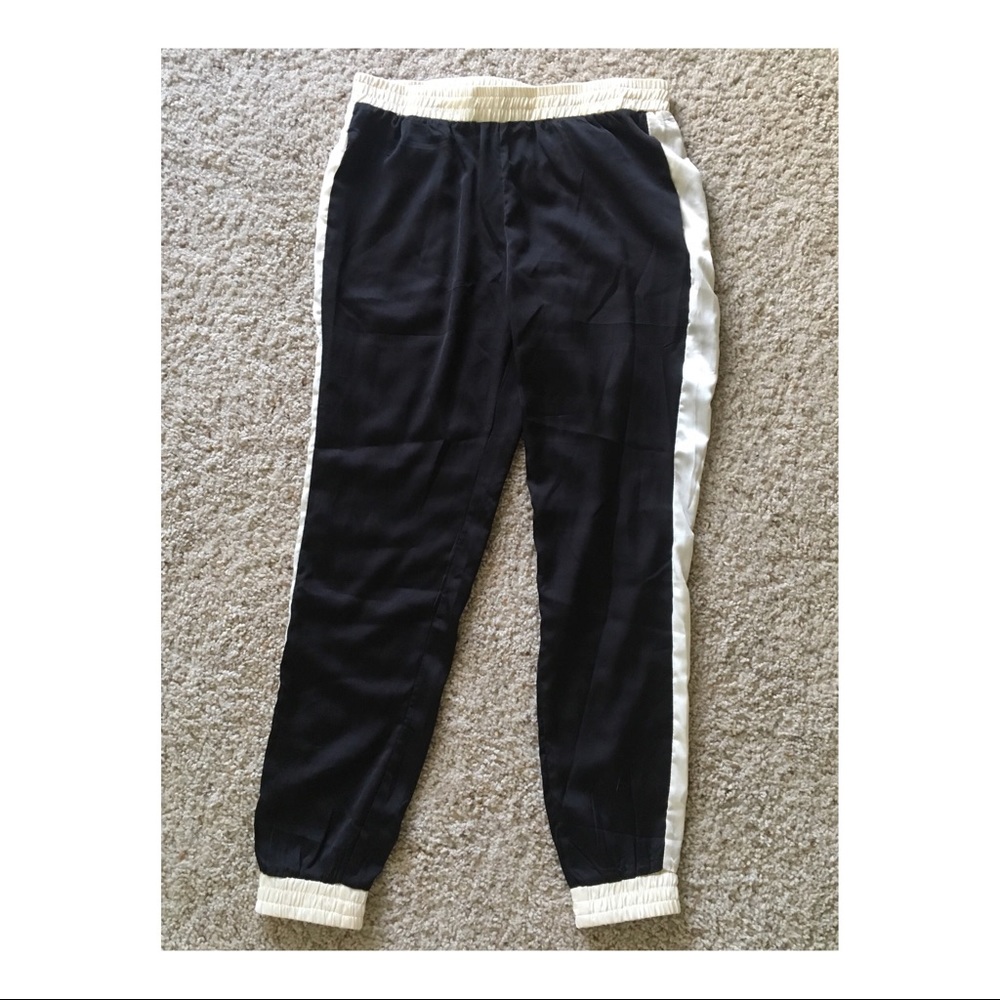 Satin-like poncho pants with tuxedo stripe