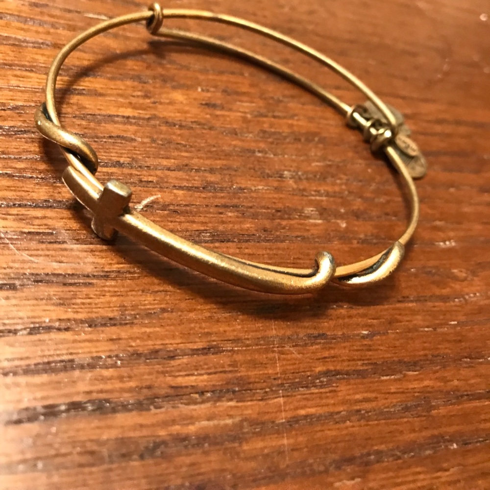 Alex and any gold cross bracelet