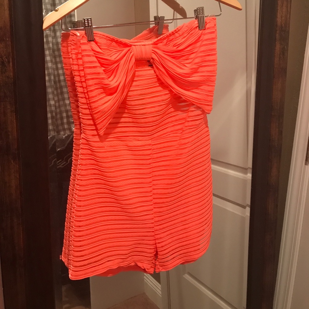 Peach color romper.
