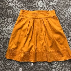 Yellow gold skirt with pockets
