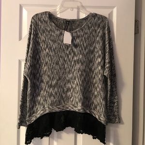 Black and white sweater with bottom lace detail