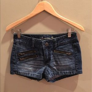 American Eagle demon shorts with zipper decals