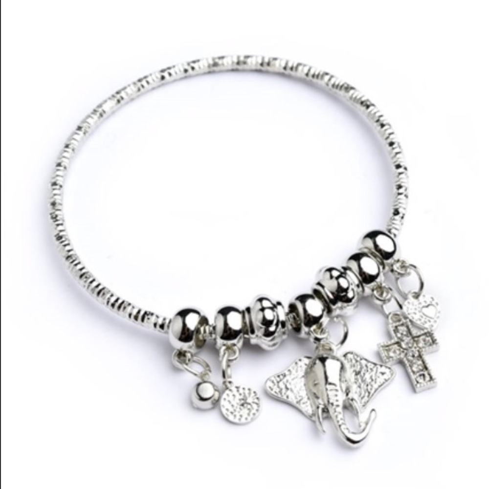 Silver and gold elephant and cross charm bracelet