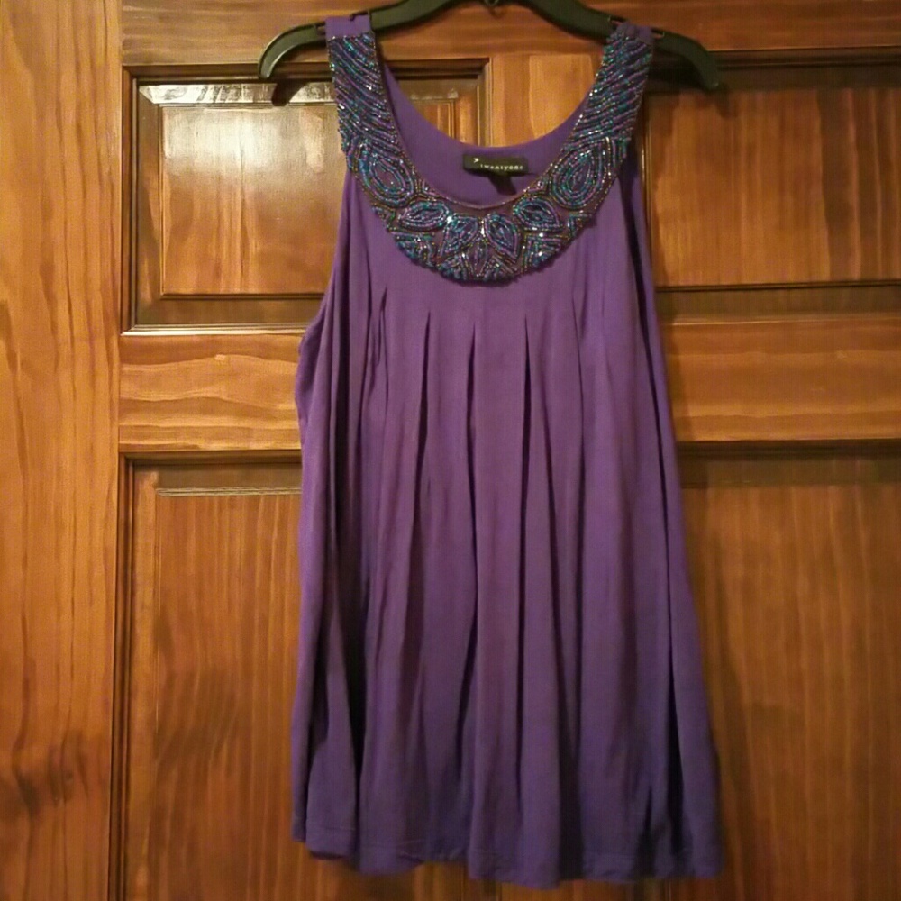 Purple, elegant blouse with bedded design