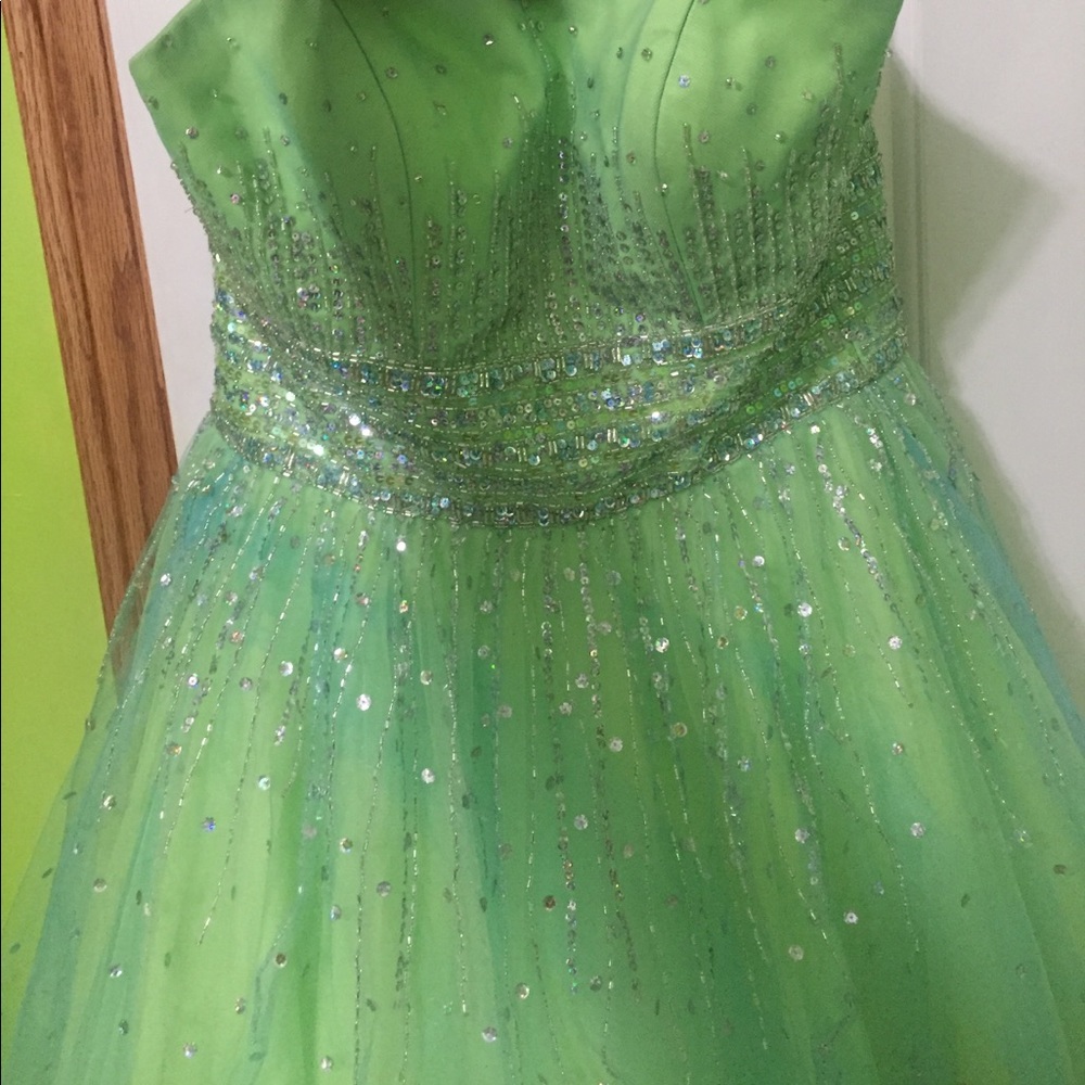 Green strapless prom dress with cross tie back