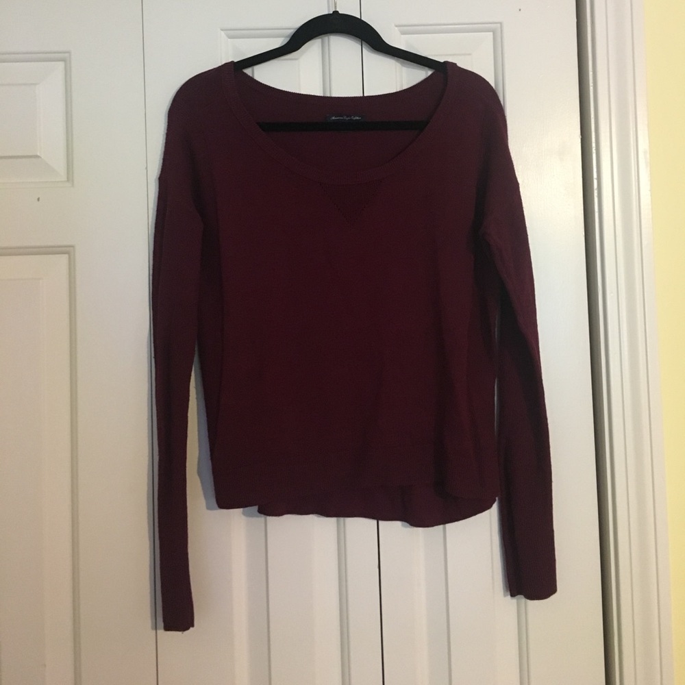 Maroon sweater.
