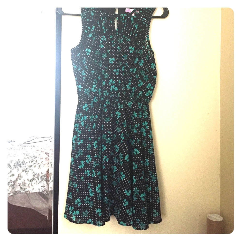 A green floral and polka dotted Dress