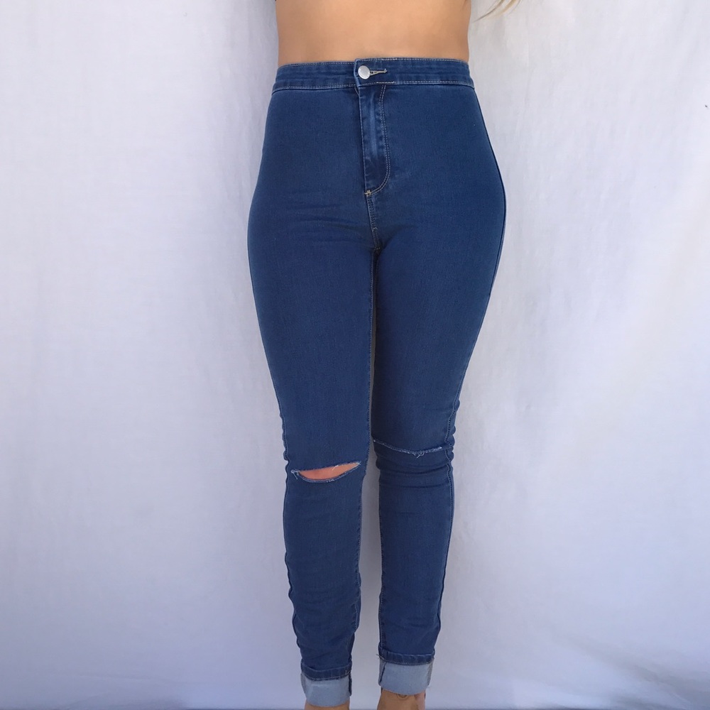 High waisted skinny jeans with slit on knee