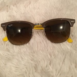 Ray-Ban clubmaster sunglasses with yellow inside.