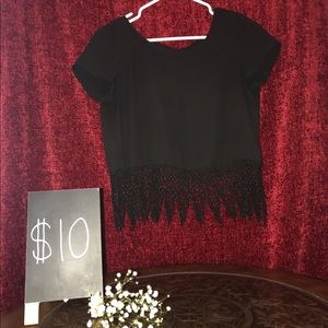 Black blouse with fringe design on the bottom