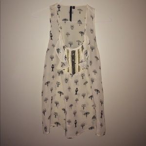 Silkish tank. Cute chandelier detail.