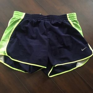 Navy blue and green Nike shorts