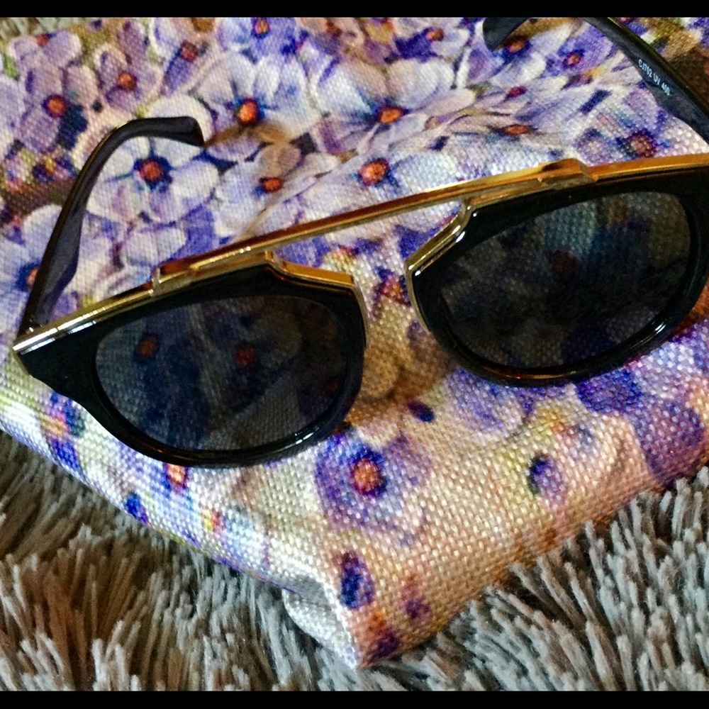 Great looking sunglasses: black with gold trim