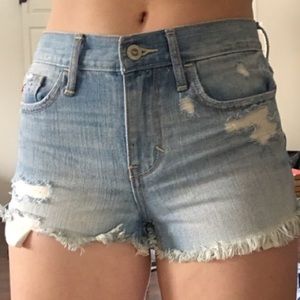 High waisted light wash distressed denim shorts
