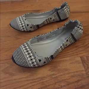 Black and white Aztec designed flats