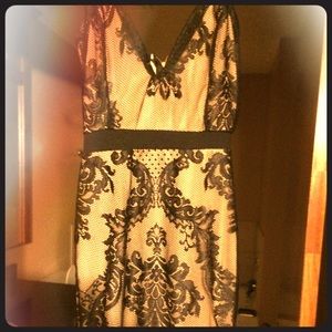 Cream colored dress with black lace overlay