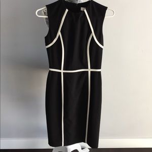 Black sleeveless sheath dress