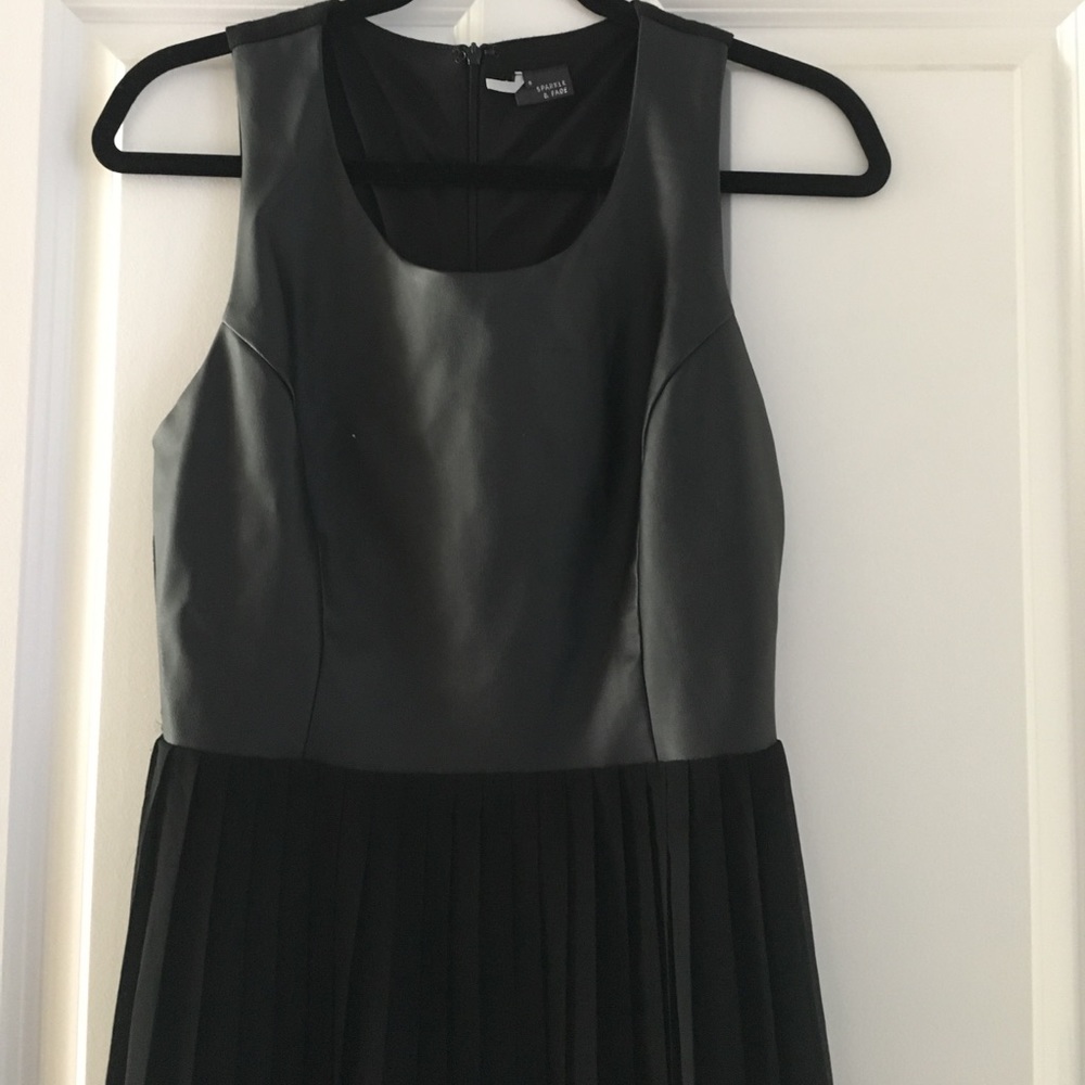 Black faux leather top with chiffon skirt