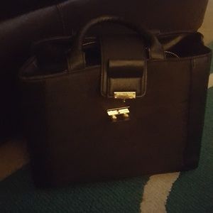 Spacious black handbag with many compartments