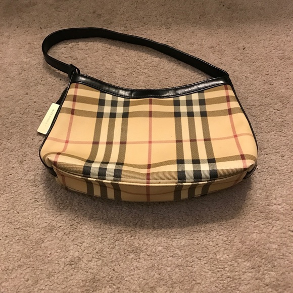 Burberry Handbags - Authentic Burberry purse with blk leather strap
