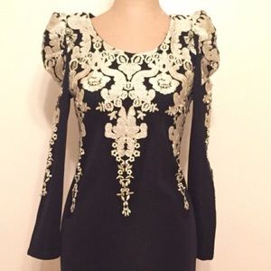 Black and gold floral long sleeved dress