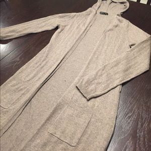 Tan knee-length cardigan with front pockets & hood