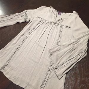 Gray 3/4 sleeve top with cut out accents.