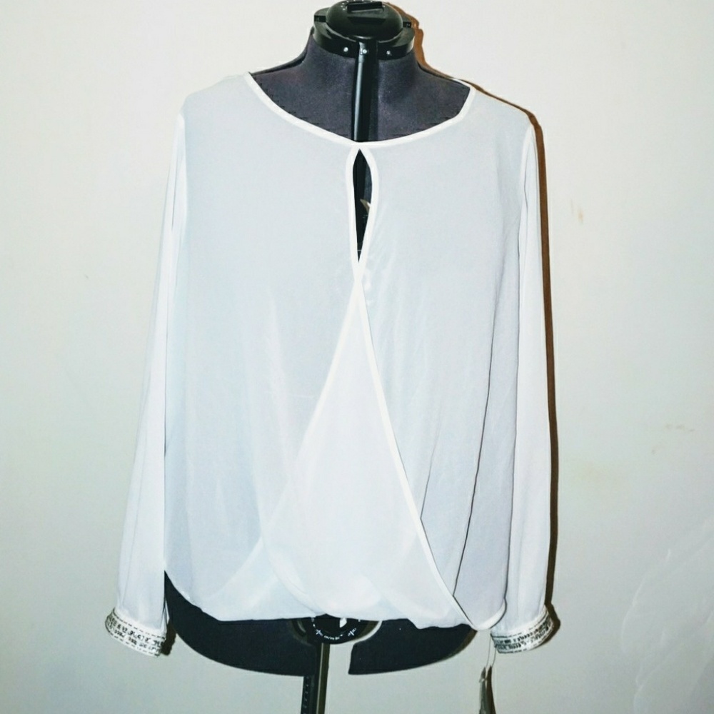 White cut out blouse with sequin cuff detail