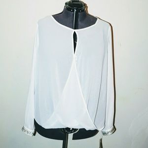 White cut out blouse with sequin cuff detail