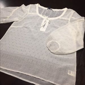 Lightweight printed blouse with tie front.