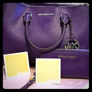 Purple Michael Kors satchel and matching wallet