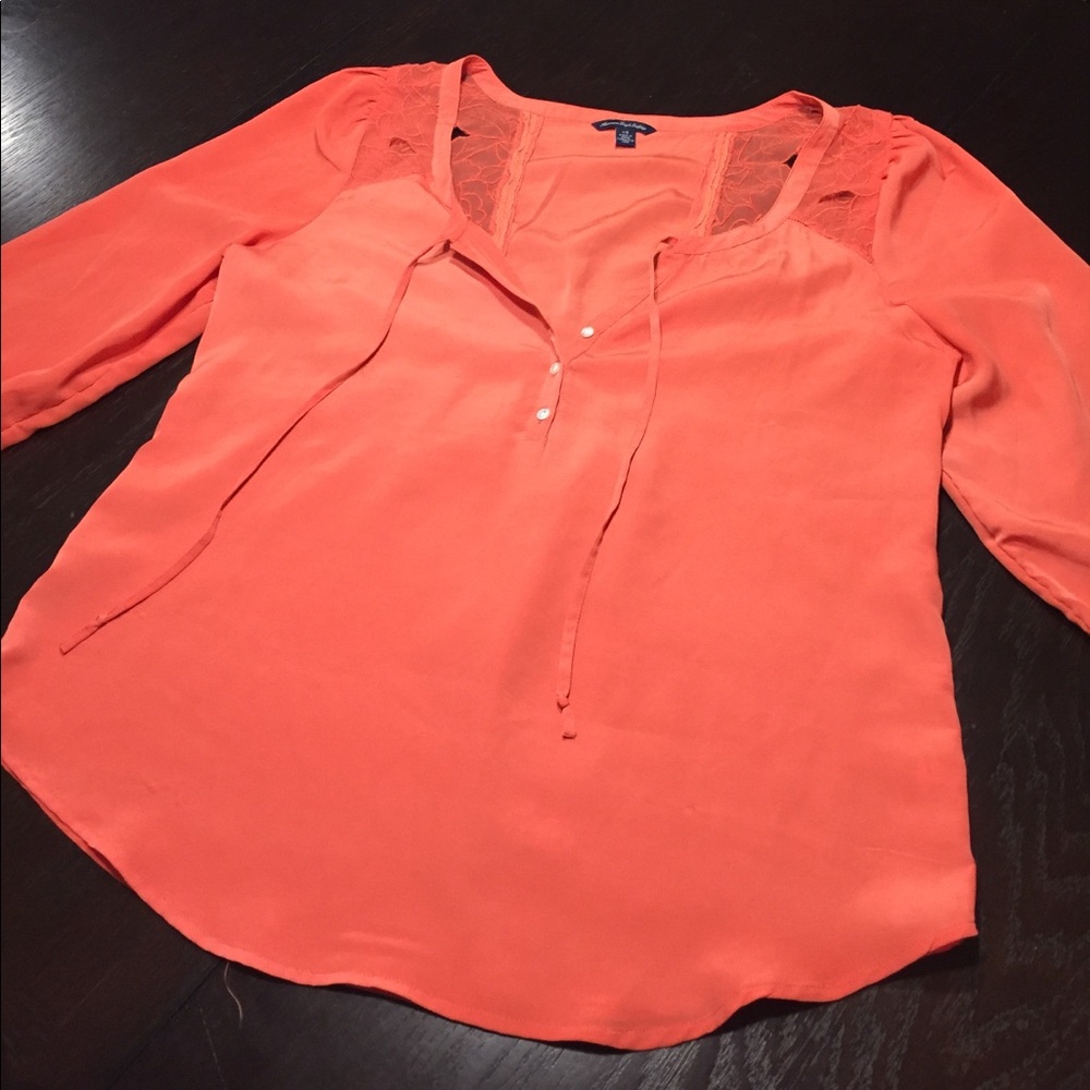 Orange blouse w/ tie front & cutout floral accents