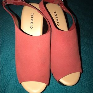 Rust colored wedge sandal.