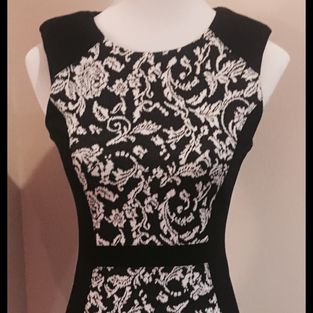 WAREHOUSE black dress w/ white floral/lace print.