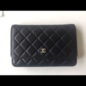 Chanel WOC black cross baby bag