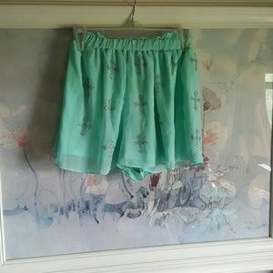Mint high waisted shorts w/ cross embellishment