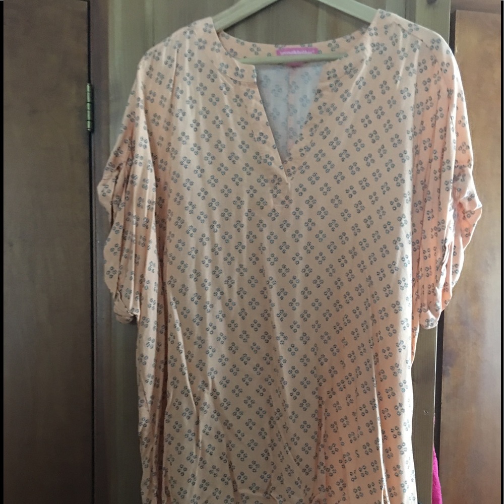 Orange sherbet tunic with geometric designs.