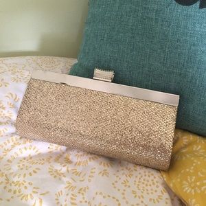 Sparkly clutch bag with hide-away chain strap.